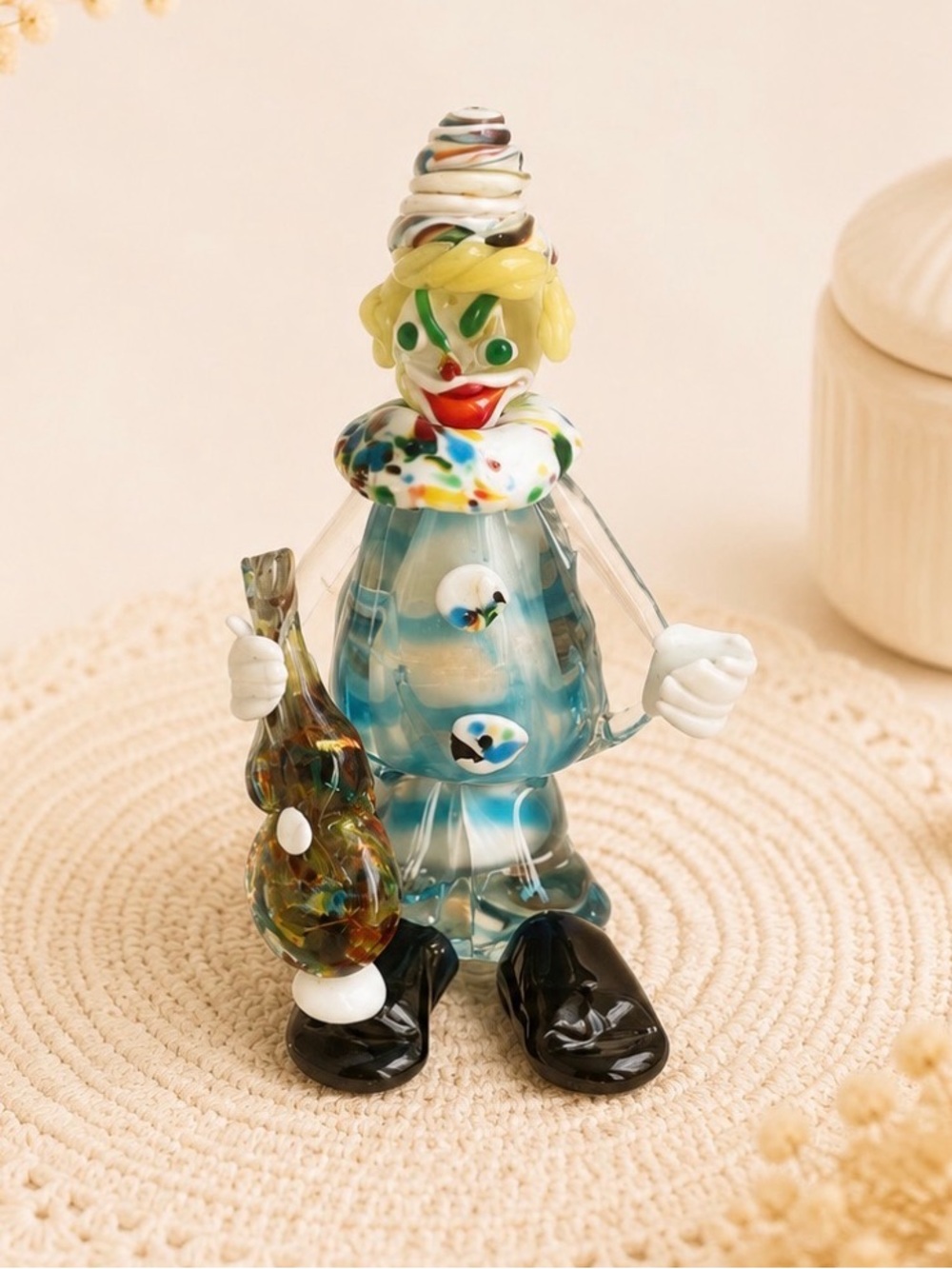 Murano glass clown figurine holding a guitar
